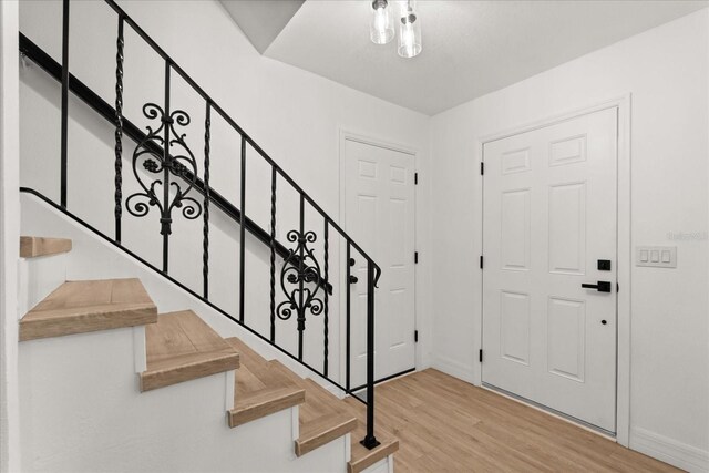 3655 Scott St, Port Orange, FL 32129 - entryway featuring wood finished floors and stairway