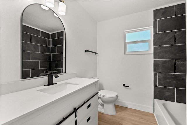 3655 Scott St, Port Orange, FL 32129 - bathroom featuring vanity, wood finished floors, and shower / bathtub combination