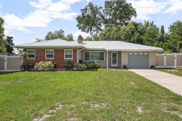 502 W Hogle Ave, Deland, FL 32720 - ranch-style home featuring a chimney, a garage, concrete driveway, a metal roof, and brick siding
