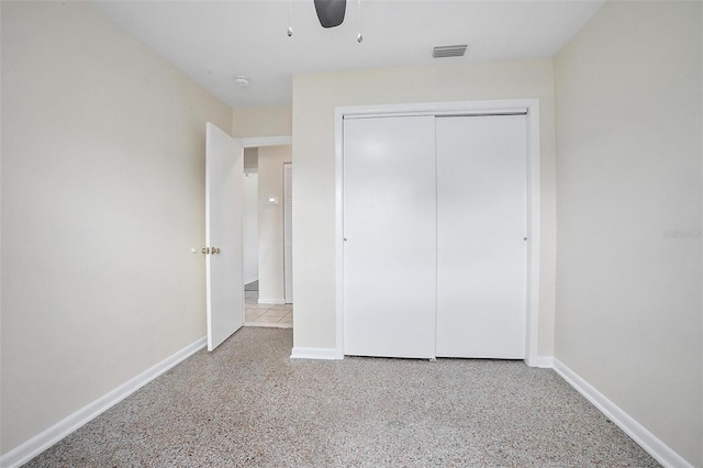 502 W Hogle Ave, Deland, FL 32720 - unfurnished bedroom with a closet, speckled floor, and ceiling fan