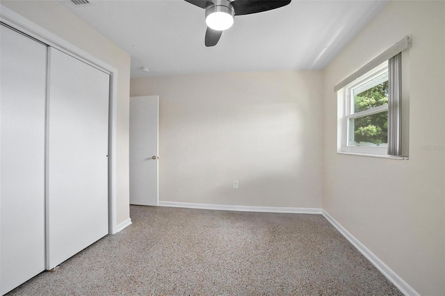 502 W Hogle Ave, Deland, FL 32720 - unfurnished bedroom featuring a closet, ceiling fan, and speckle patterned floor