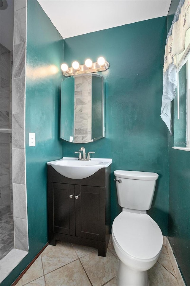 502 W Hogle Ave, Deland, FL 32720 - bathroom with vanity, tile patterned flooring, and tiled shower