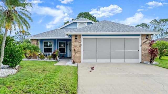 123 Wood Ibis Ct, Daytona Beach, FL 32119 - ranch-style home featuring brick siding, driveway, roof with shingles, an attached garage, and a front yard