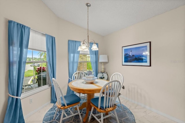 123 Wood Ibis Ct, Daytona Beach, FL 32119 - dining area featuring marble look tiles, a chandelier, vaulted ceiling, and a textured ceiling