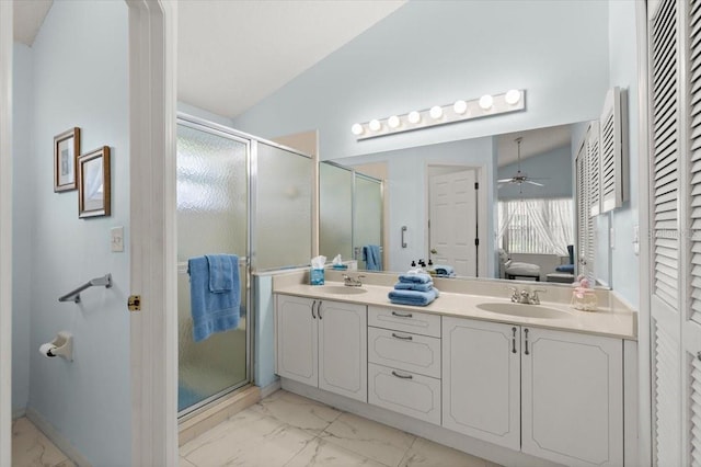 123 Wood Ibis Ct, Daytona Beach, FL 32119 - ensuite bathroom featuring marble finish floors, double vanity, a stall shower, and a ceiling fan