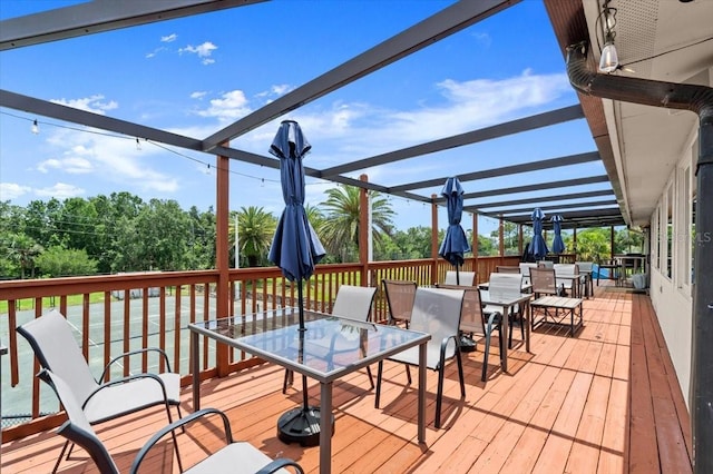 123 Wood Ibis Ct, Daytona Beach, FL 32119 - deck with outdoor dining area and a pergola