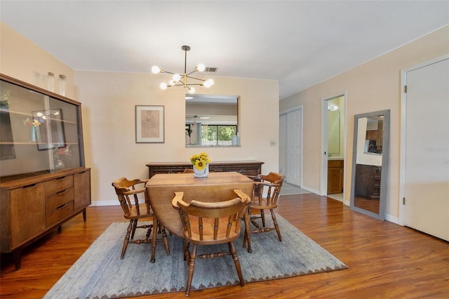 874 Commonwealth Ct, Casselberry, FL 32707 - dining area featuring a chandelier and wood finished floors