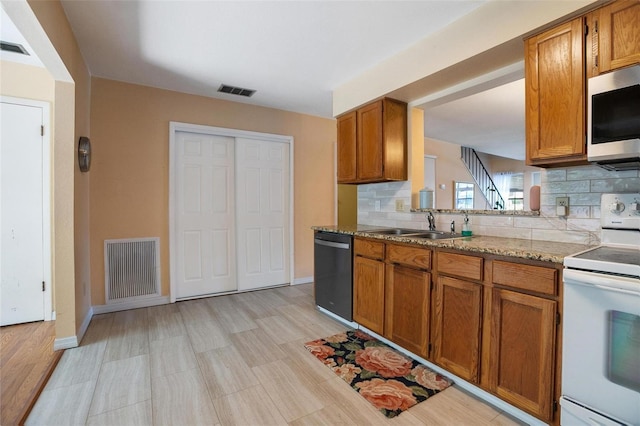 874 Commonwealth Ct, Casselberry, FL 32707 - kitchen featuring electric stove, stainless steel microwave, dishwashing machine, and tasteful backsplash