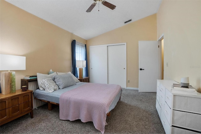 874 Commonwealth Ct, Casselberry, FL 32707 - carpeted bedroom with vaulted ceiling, a closet, ceiling fan, and a textured ceiling