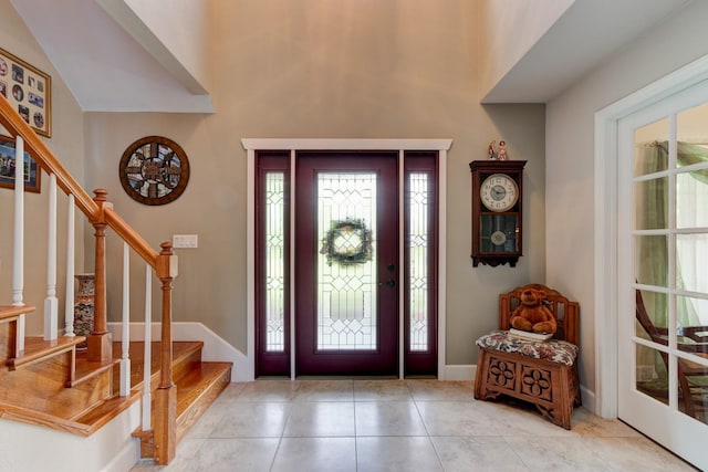 1383 Tumblin Dr, New Smyrna Beach, FL 32168 - tiled entryway featuring stairs and baseboards