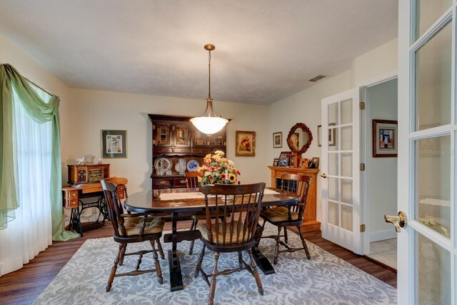 1383 Tumblin Dr, New Smyrna Beach, FL 32168 - dining area featuring french doors and dark wood finished floors