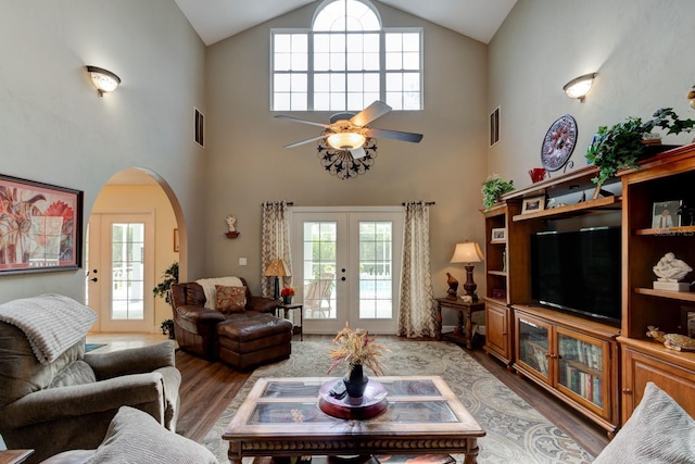 1383 Tumblin Dr, New Smyrna Beach, FL 32168 - living area with light wood-style floors, arched walkways, plenty of natural light, high vaulted ceiling, and a ceiling fan