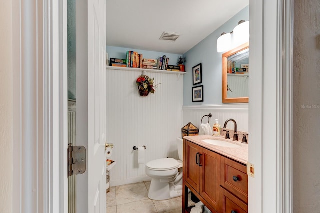1383 Tumblin Dr, New Smyrna Beach, FL 32168 - half bathroom with vanity, tile patterned flooring, and wainscoting
