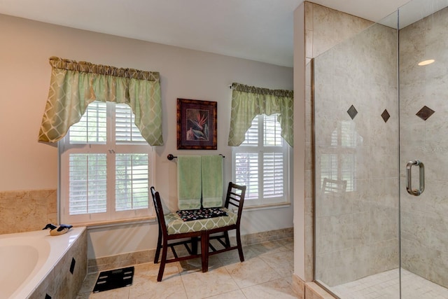 1383 Tumblin Dr, New Smyrna Beach, FL 32168 - full bathroom with healthy amount of natural light, a stall shower, a garden tub, and tile patterned floors