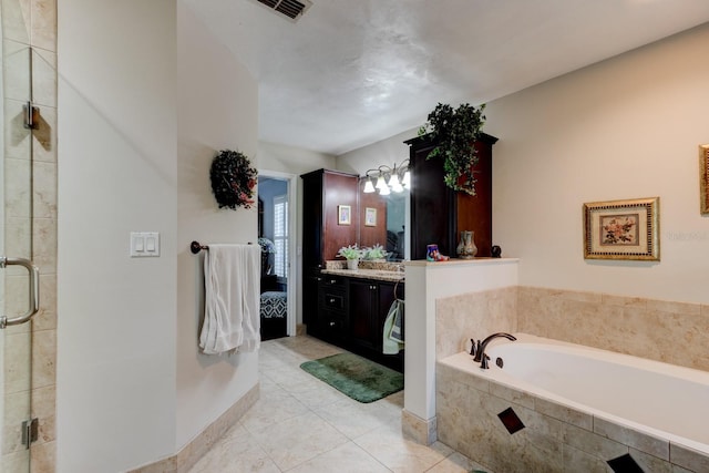 1383 Tumblin Dr, New Smyrna Beach, FL 32168 - full bath with vanity, a bath, a shower stall, and tile patterned flooring
