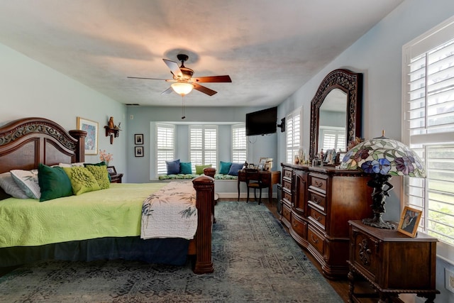 1383 Tumblin Dr, New Smyrna Beach, FL 32168 - bedroom with dark wood-style flooring and ceiling fan