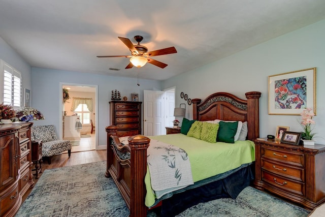 1383 Tumblin Dr, New Smyrna Beach, FL 32168 - bedroom featuring wood finished floors, ceiling fan, and ensuite bath