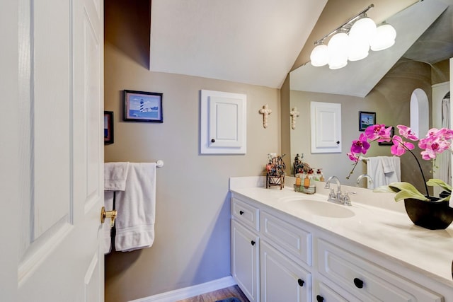 1383 Tumblin Dr, New Smyrna Beach, FL 32168 - bathroom with vanity and vaulted ceiling