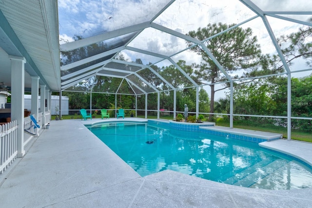 1383 Tumblin Dr, New Smyrna Beach, FL 32168 - swimming pool with a patio and glass enclosure