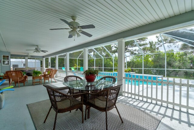 1383 Tumblin Dr, New Smyrna Beach, FL 32168 - sunroom / solarium featuring a ceiling fan, outdoor dining area, and healthy amount of natural light