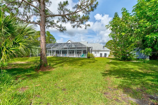 1383 Tumblin Dr, New Smyrna Beach, FL 32168 - back of property with a lawn and a lanai