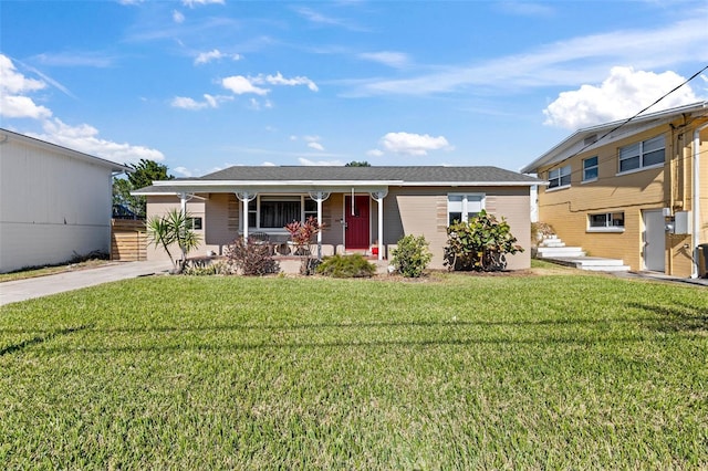 505 Wisteria Rd, Daytona Beach, FL 32118 - ranch-style house with covered porch and a front yard