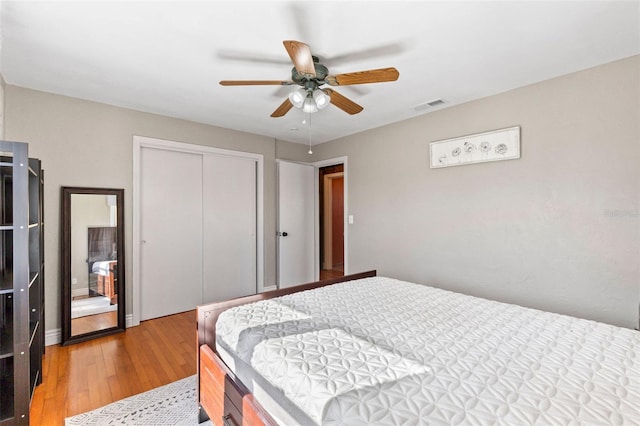505 Wisteria Rd, Daytona Beach, FL 32118 - bedroom with light wood-style flooring, a closet, and ceiling fan