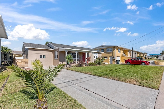 505 Wisteria Rd, Daytona Beach, FL 32118 - ranch-style home with a porch and concrete driveway
