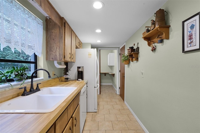 270 Sandyhook Ln, Deland, FL 32724 - kitchen featuring light tile patterned flooring, dishwasher, recessed lighting, and brown cabinetry