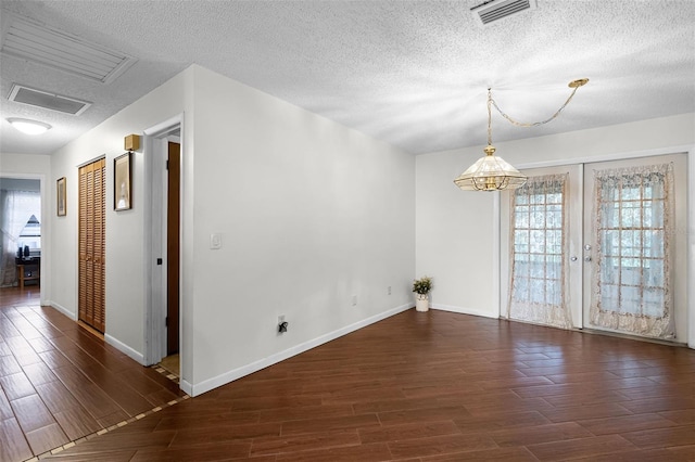 270 Sandyhook Ln, Deland, FL 32724 - unfurnished room with wood finished floors, a textured ceiling, and french doors