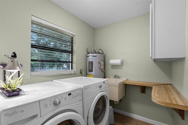270 Sandyhook Ln, Deland, FL 32724 - laundry area with electric water heater, separate washer and dryer, tile patterned flooring, and cabinet space