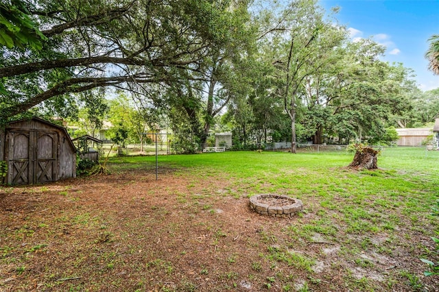 270 Sandyhook Ln, Deland, FL 32724 - view of yard featuring a storage shed and an outdoor fire pit