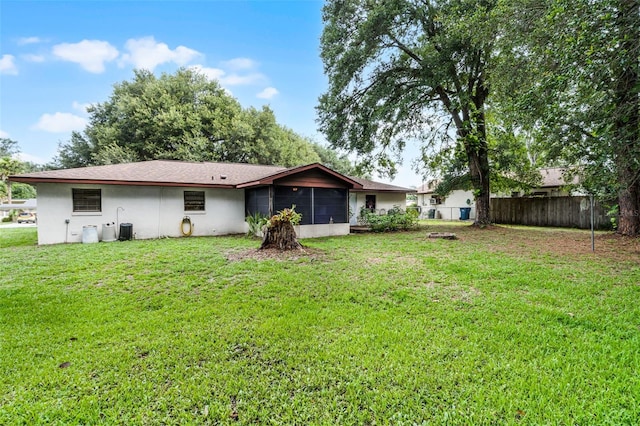 270 Sandyhook Ln, Deland, FL 32724 - back of house featuring a sunroom and stucco siding
