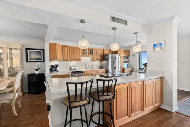 3003 S Atlantic Ave Unit 3A2, Daytona Beach Shores, FL 32118 - kitchen with appliances with stainless steel finishes, a peninsula, dark wood-style floors, ornamental molding, and glass insert cabinets