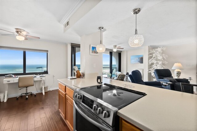 3003 S Atlantic Ave Unit 3A2, Daytona Beach Shores, FL 32118 - kitchen with stainless steel range with electric stovetop, a ceiling fan, brown cabinets, an office area, and healthy amount of natural light
