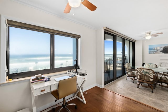3003 S Atlantic Ave Unit 3A2, Daytona Beach Shores, FL 32118 - home office with a ceiling fan, ornamental molding, wood finished floors, and a water view