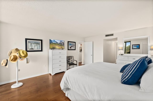 3003 S Atlantic Ave Unit 3A2, Daytona Beach Shores, FL 32118 - bedroom featuring dark wood-style flooring and baseboards