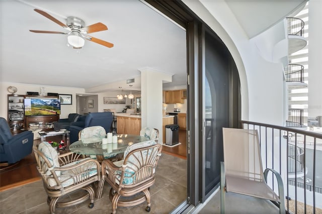 3003 S Atlantic Ave Unit 3A2, Daytona Beach Shores, FL 32118 - dining area with a ceiling fan and arched walkways
