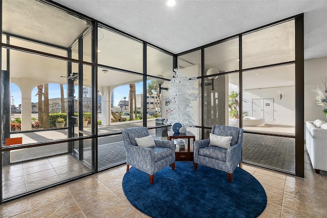 3003 S Atlantic Ave Unit 3A2, Daytona Beach Shores, FL 32118 - lobby with expansive windows and a textured ceiling