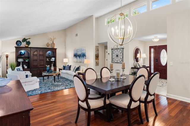 3 Pine Meadow Ct, Debary, FL 32713 - dining space with a chandelier, dark wood-type flooring, high vaulted ceiling, and a textured ceiling