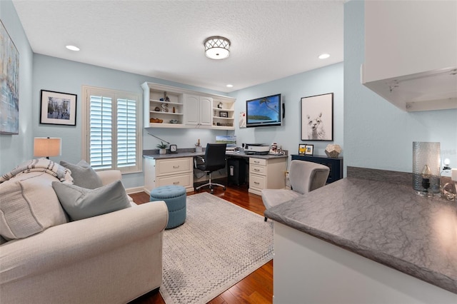 3 Pine Meadow Ct, Debary, FL 32713 - office space with dark wood-style flooring, built in desk, recessed lighting, and a textured ceiling