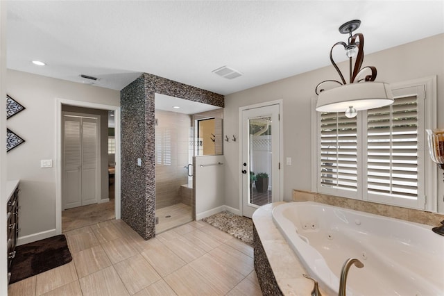 3 Pine Meadow Ct, Debary, FL 32713 - bathroom featuring a tub with jets, a stall shower, vanity, and tile patterned floors