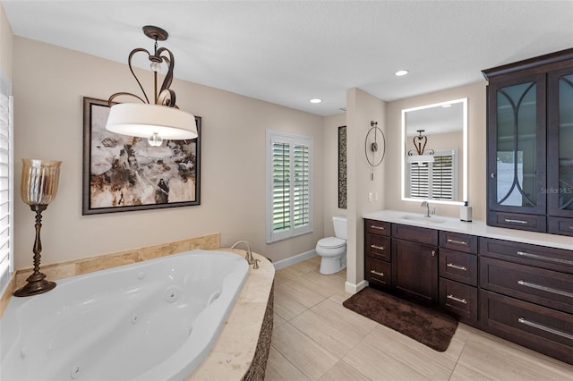 3 Pine Meadow Ct, Debary, FL 32713 - bathroom featuring a tub with jets, vanity, and recessed lighting