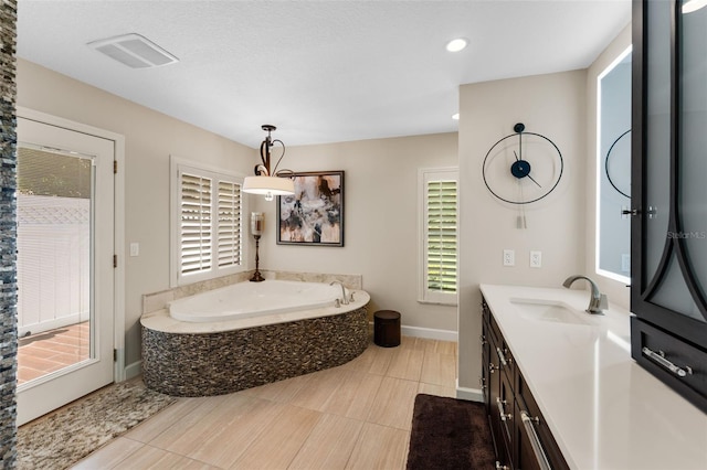 3 Pine Meadow Ct, Debary, FL 32713 - full bathroom featuring a garden tub, vanity, recessed lighting, and tile patterned flooring