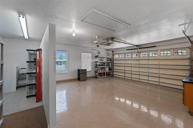 3 Pine Meadow Ct, Debary, FL 32713 - garage featuring a garage door opener and freestanding refrigerator