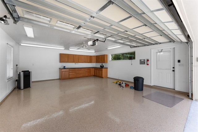 3 Pine Meadow Ct, Debary, FL 32713 - garage with a garage door opener and a ceiling fan