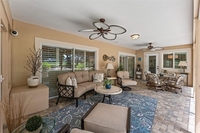3 Pine Meadow Ct, Debary, FL 32713 - living room with ceiling fan and a textured ceiling
