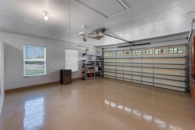 3 Pine Meadow Ct, Debary, FL 32713 - garage with refrigerator, a garage door opener, and a ceiling fan