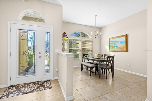 727 Grape Ivy Ln, New Smyrna Beach, FL 32168 - entrance foyer with a chandelier and light tile patterned flooring