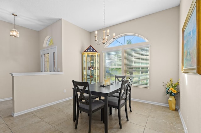 727 Grape Ivy Ln, New Smyrna Beach, FL 32168 - dining area with a chandelier, plenty of natural light, and light tile patterned floors